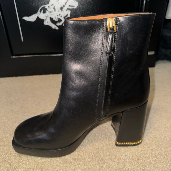 Tory Burch ruby black leather ankle boot with gold chain accent. Read caption - Picture 1 of 6